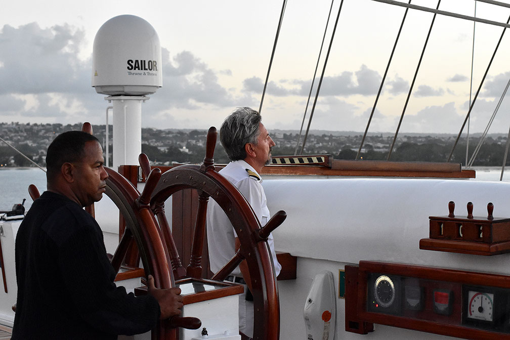 Captain Mariusz Szalek and mate Marco work to bring the Royal Clipper back into Barbados. Photograph, Ann Fisher.
