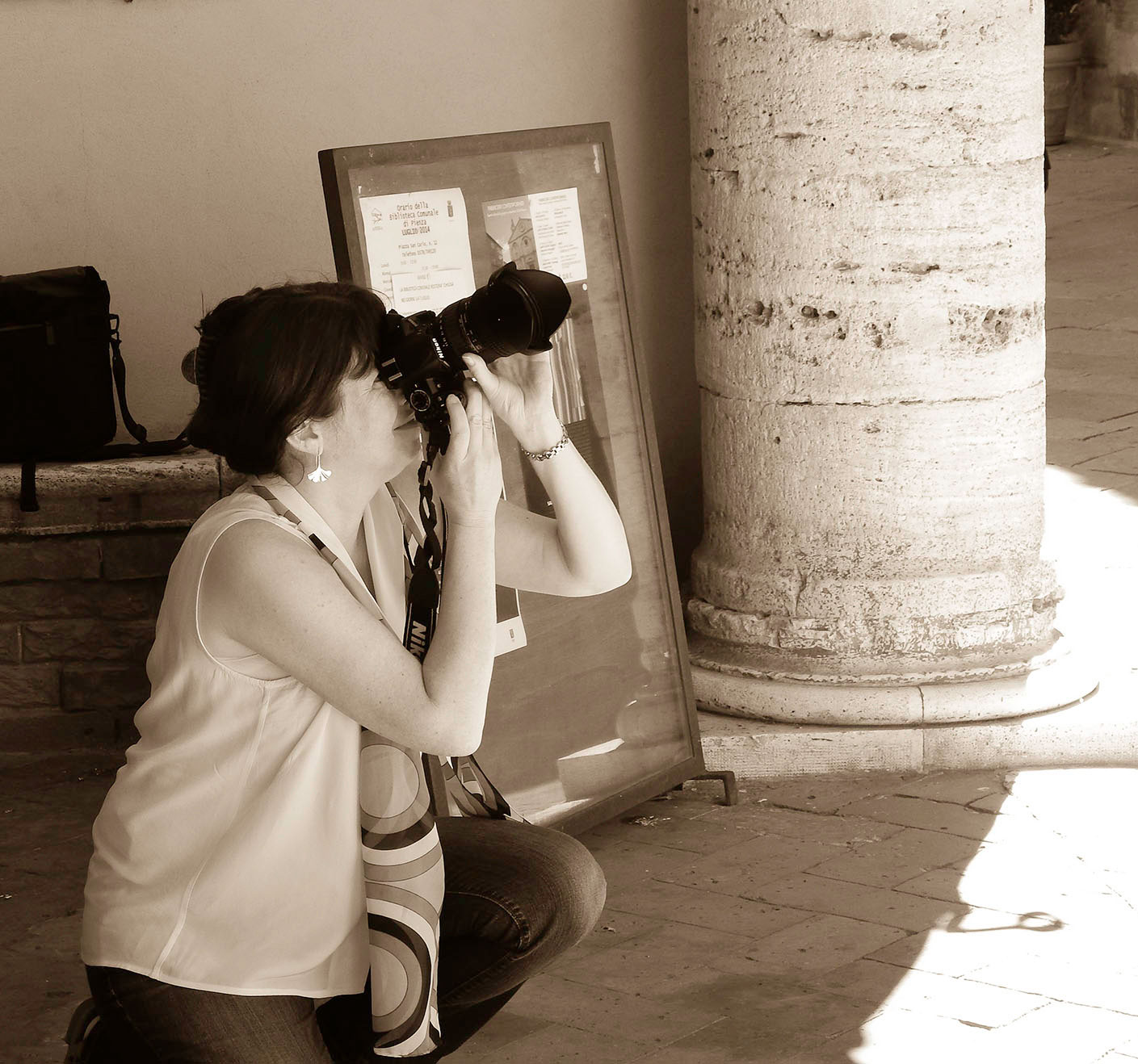 Ann Fisher taking photographs in Pienza Italy