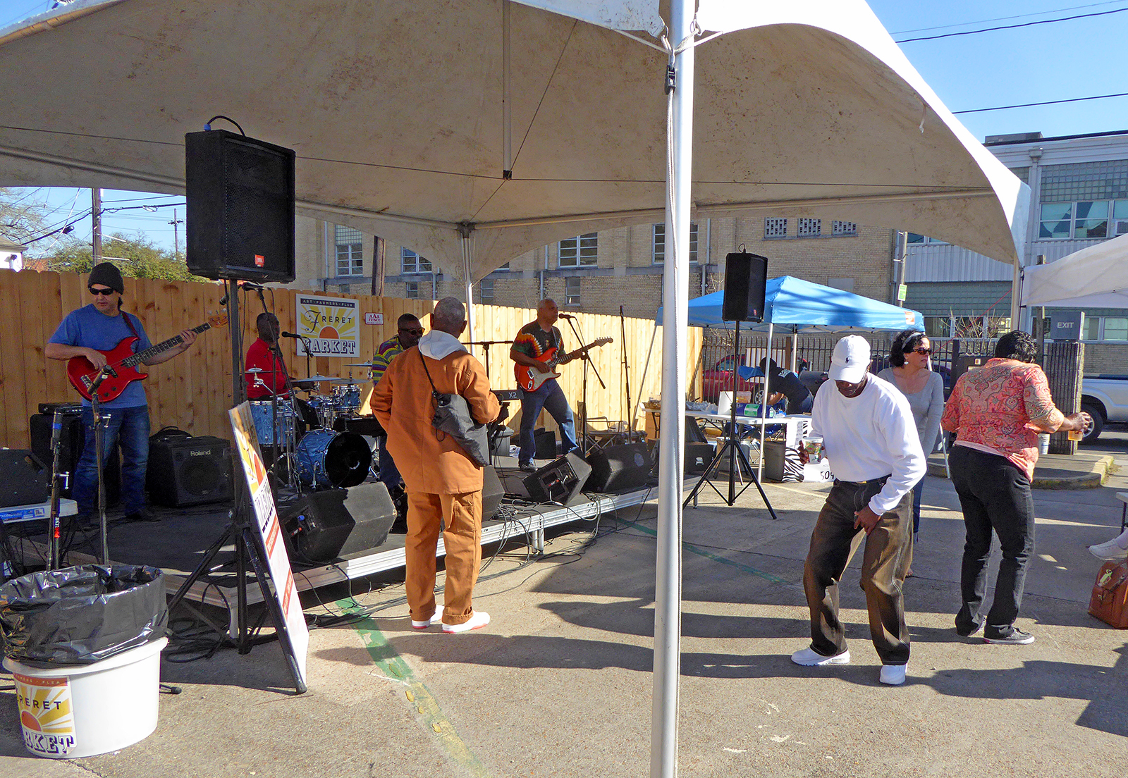 People dancing to live music at the Freret Street Market.