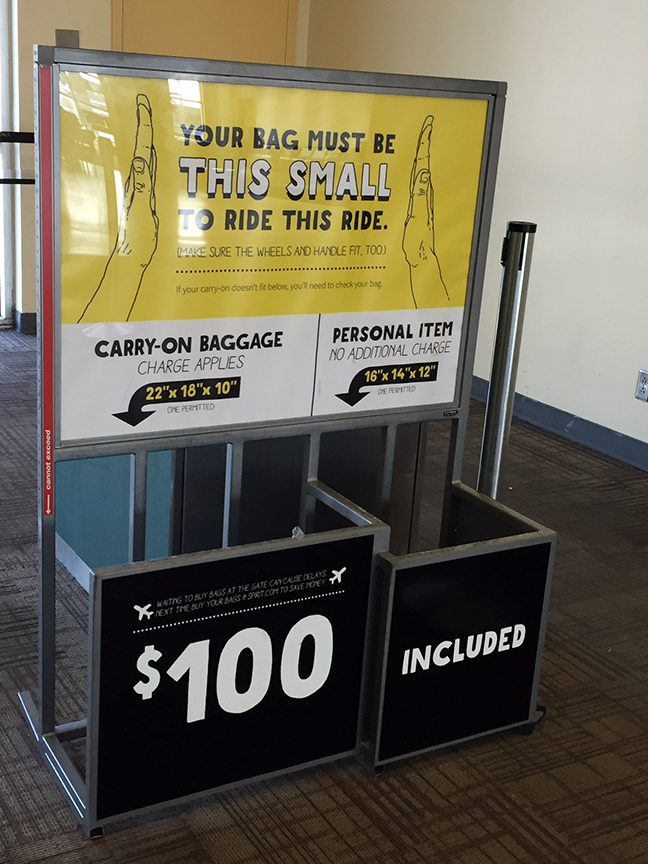 Spirit airlines sign $100 carry on bag policy