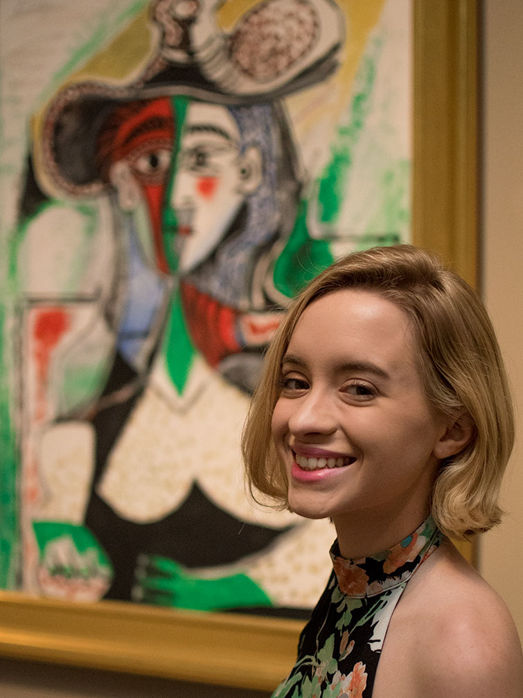 Girl standing in front of a Picasso