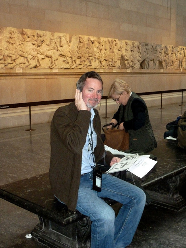 man using the audio guide: the British Museum My Way. 