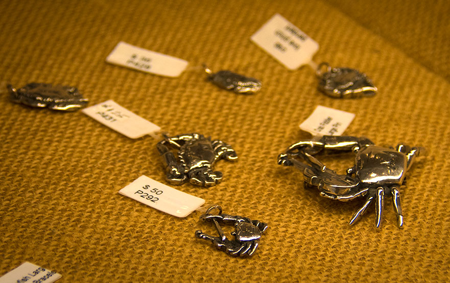 Tiny sterling silver crabs in a variety of designs. 
