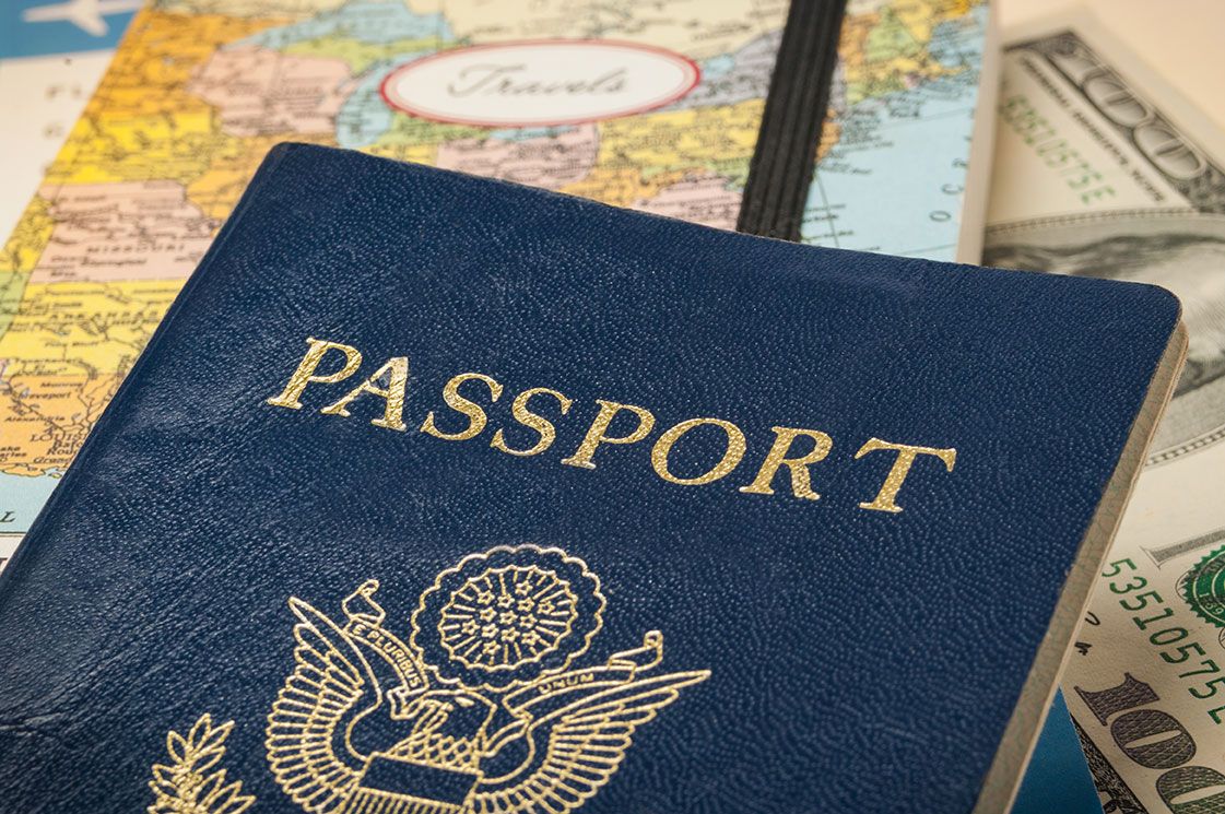 Photograph of US passport on a map.