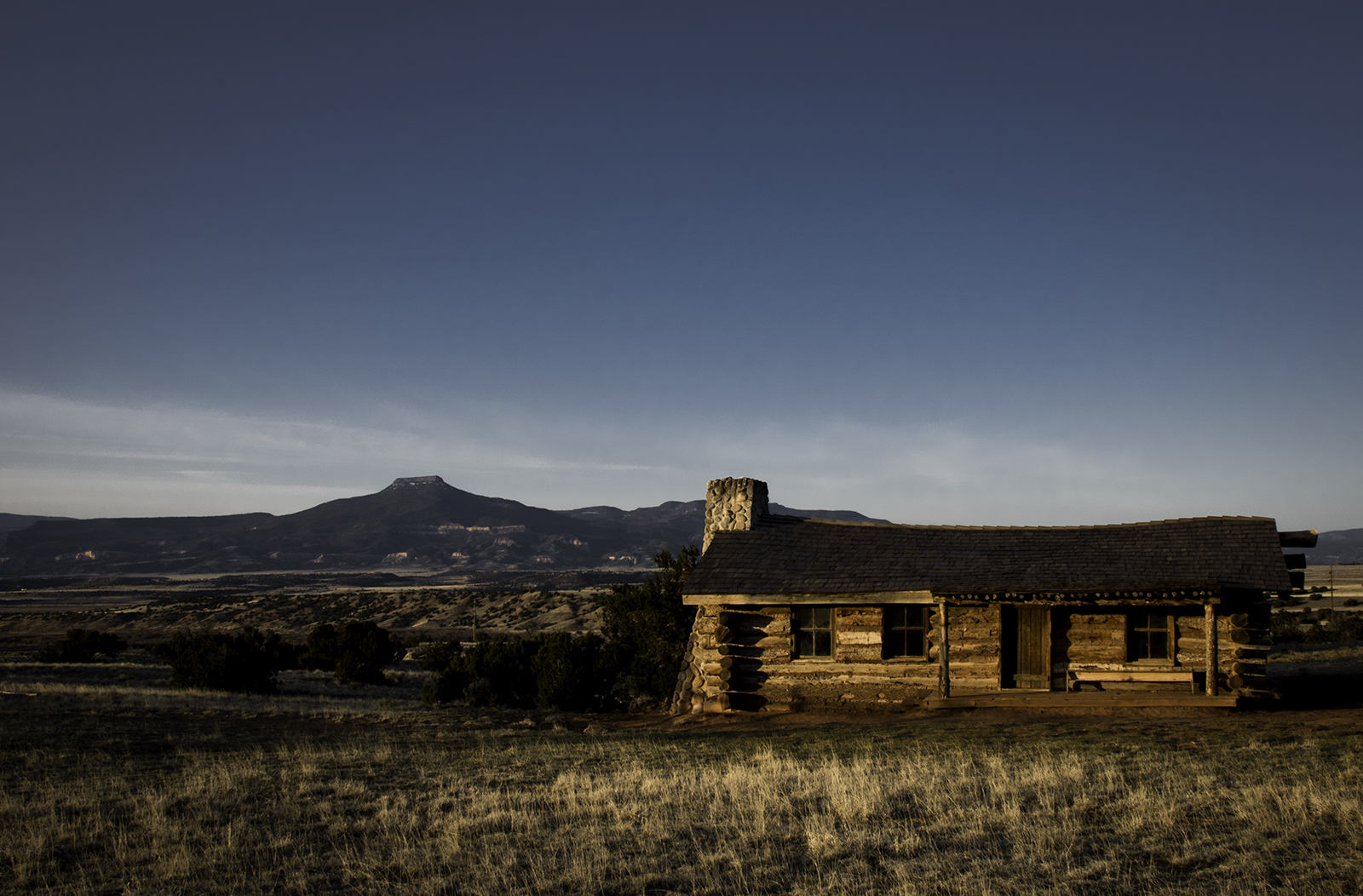 City Slickers Cabin on Ghost Ranch at sunrise, Pedernal mountain in the distance.