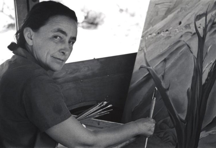 Ansel Adam's photograph of O'Keeffe painting inside her car on Ghost Ranch.