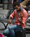 Street musician playing the violin, Jackson Square in New Orleans.