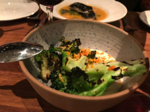 Charred broccoli with smoked Apache bleu cheese fondue and Meyer lemon. at Fixe in Austin