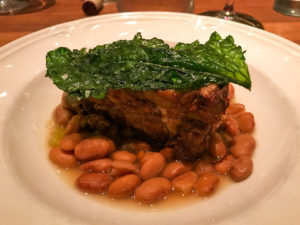 Pork shoulder with potlikker pinto beans at Fixe restaurant in Austin Texas