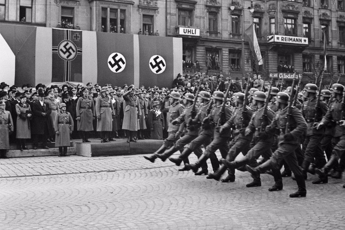 Hitler reviews troops in Prague after annexation of the Sudetenland.