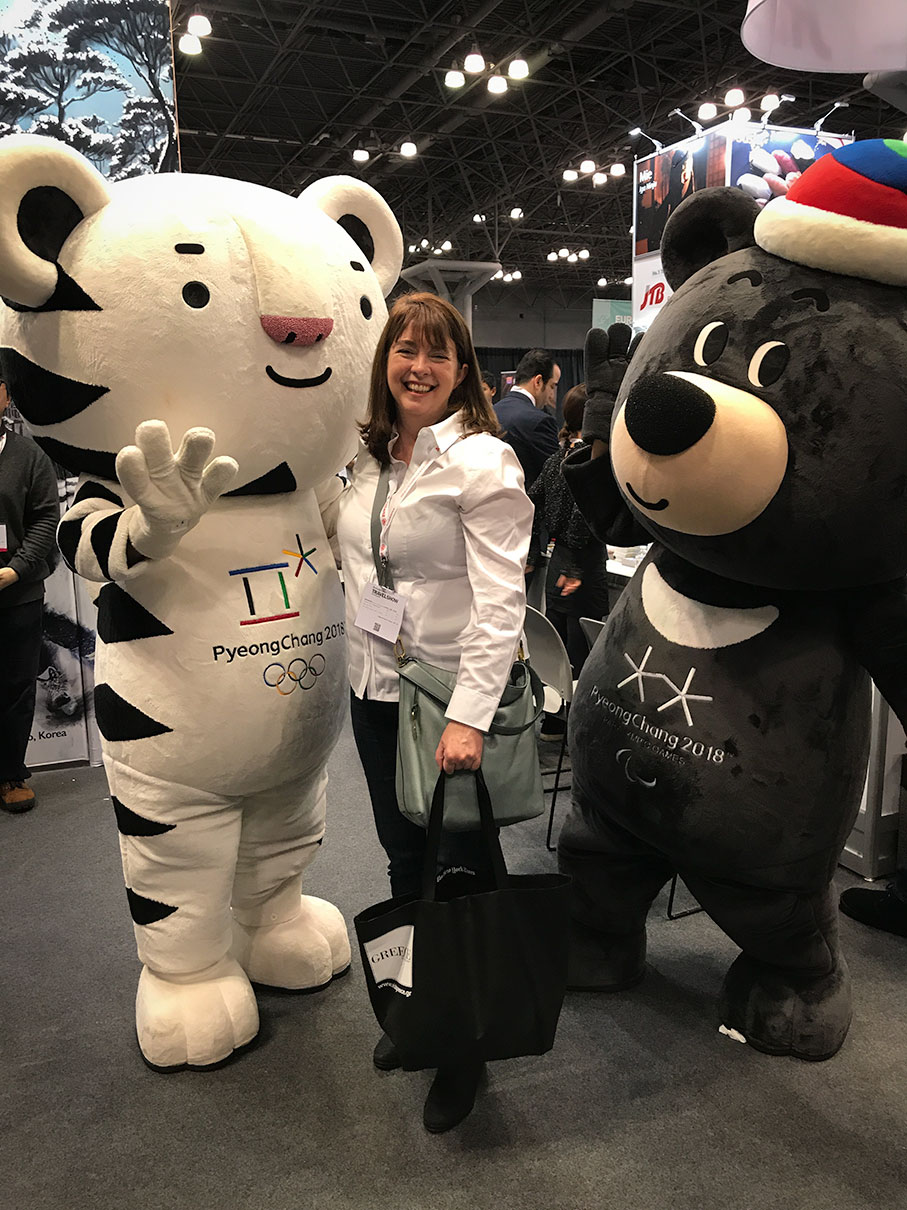 New York Times Travel Show exhibit: Getting a hug from Soohorang, the mascot of the PyeongChang 2018 Olympic Winter Games, is a white tiger -- the guardian animal of South Korea.