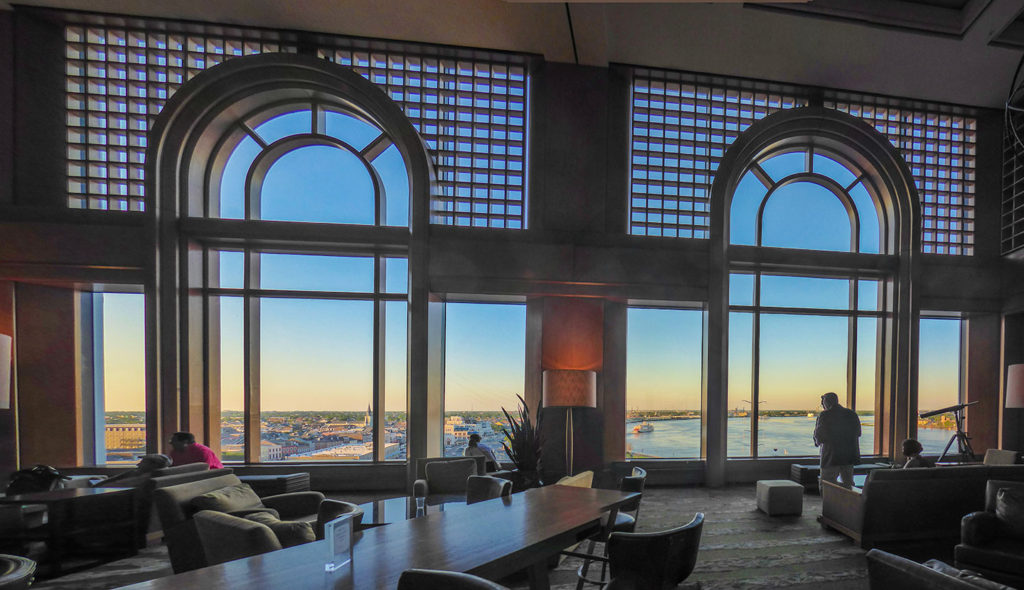 Lobby of the Westin, a luxury hotel in the French Quarter, with floor to ceiling windows looking out onto the Mississippi River 