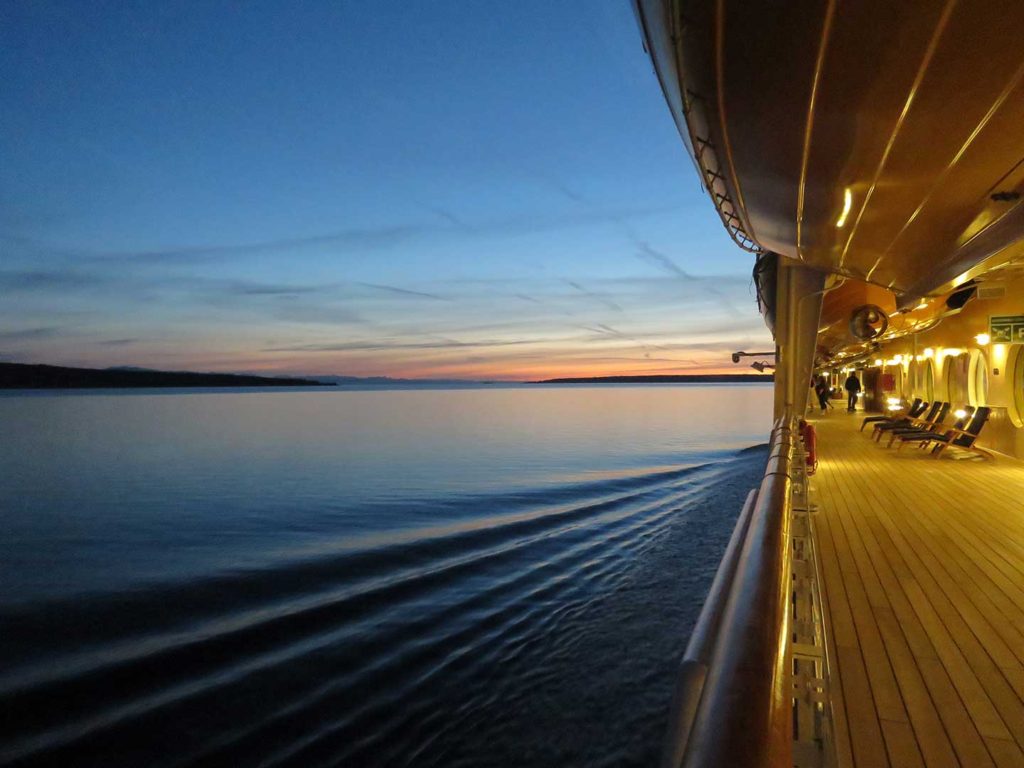 Cruise ship deck at dusk. 