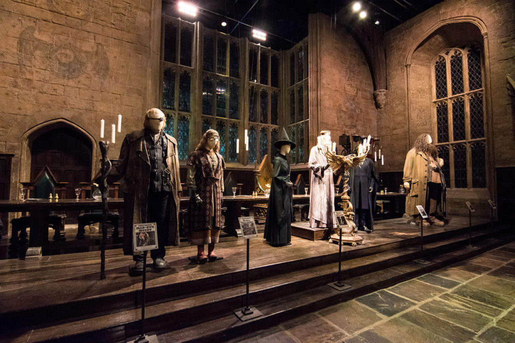 Front of the Great Hall set, with costumes of Mad-Eye Moody, Sybill Trelawney, Professor McGonagall, Dumbledore, and Hagrid.