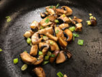 Saute mushrooms and green onions