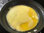 Eggs into pan