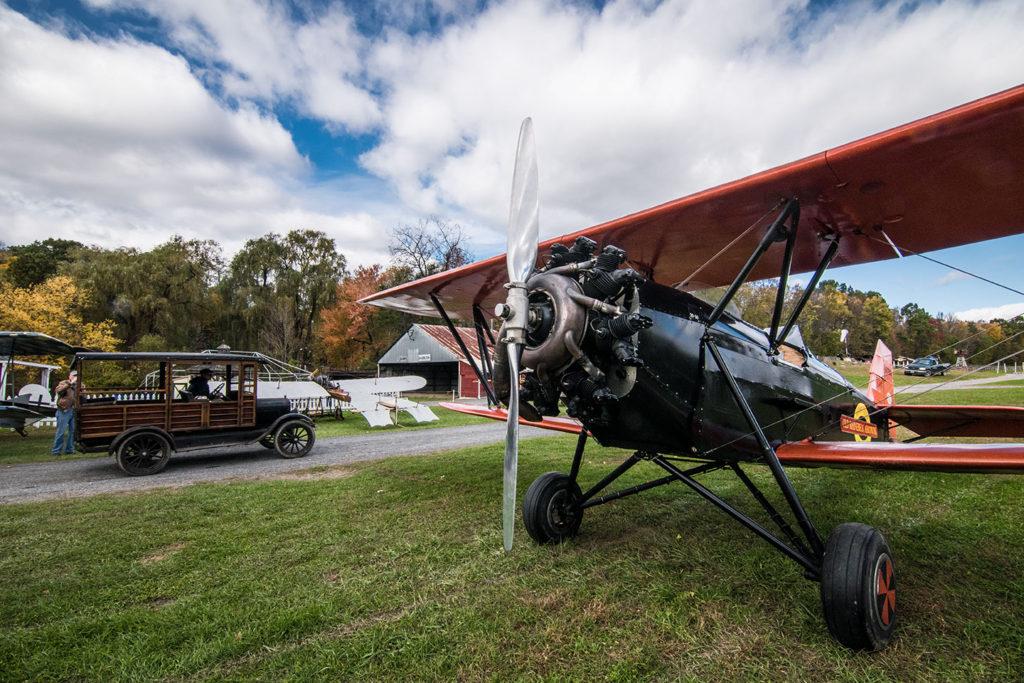 Old Rhinebeck Aerodrome: 1929 New Standard D25, with the 1926 Ford Model T Depot Hack in the background