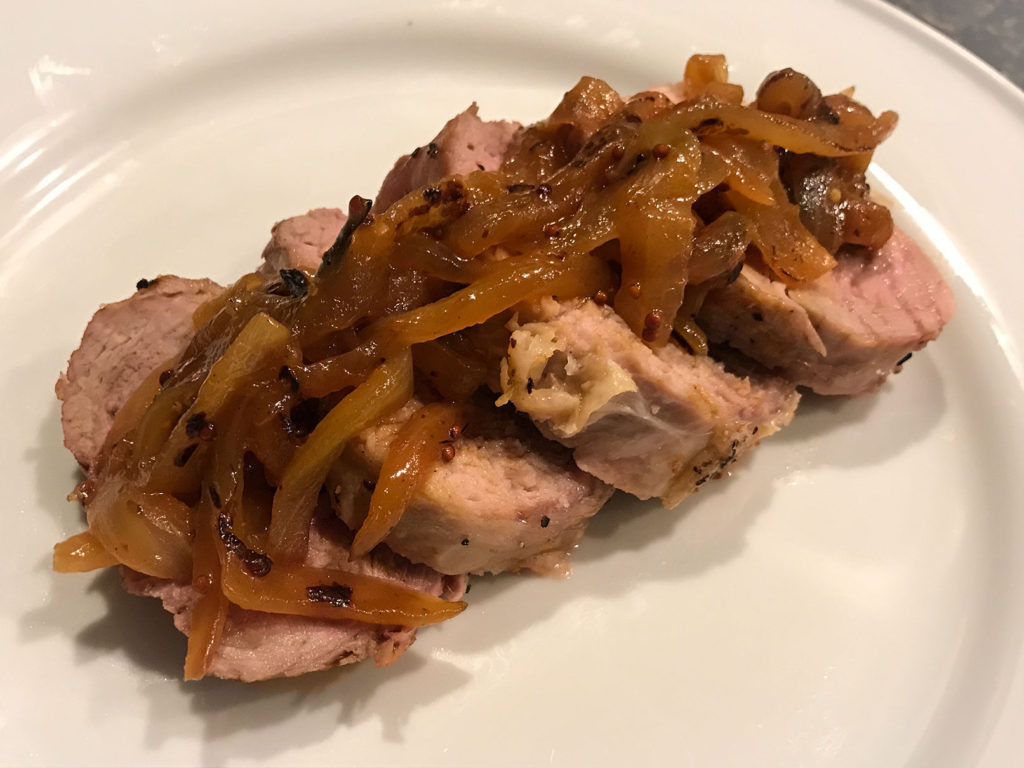 Quick onion jam with apricot preserves and French mustard on pork tenderlloin